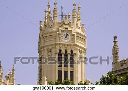 Low angle view of a clock tower, Palacio De Comunicaciones, Plaza de Cibeles, Madrid, Spain View Large Photo Image Stock Image - Low angle view of a clock tower, Palacio De Comunicaciones, Plaza de Cibeles, Madrid, Spain. Fotosearch