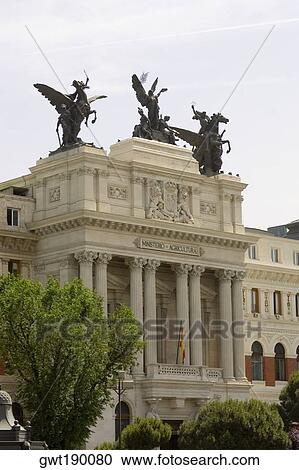 Statues on the top of a government building, Ministry Of Agriculture Building, Madrid, Spain View Large Photo Image Stock Image - Statues on the top of a government building, Ministry Of Agriculture Building, Madrid, Spain. Fotosearch
