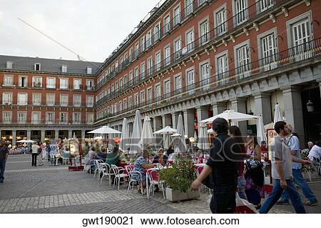 Tourists at a sidewalk cafe, Plaza Mayor, Madrid, Spain View Large Photo Image Stock Image - Tourists at a sidewalk cafe, Plaza Mayor, Madrid, Spain. Fotosearch