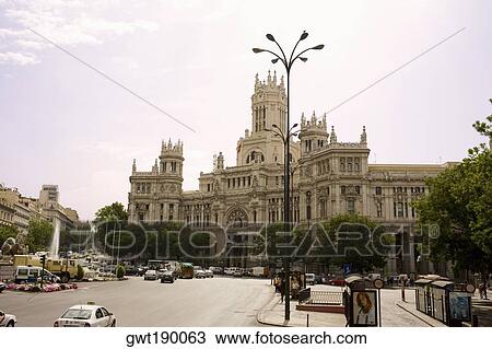 Traffic in front of a government building, Palacio De Comunicaciones, Plaza de Cibeles, Madrid, Spain View Large Photo Image Stock Image - Traffic in front of a government building, Palacio De Comunicaciones, Plaza de Cibeles, Madrid, Spain. Fotosearch