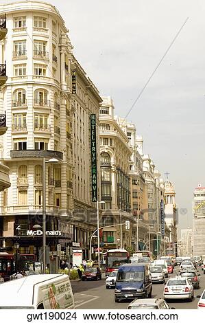 Traffic on a road in front of a hotel, TRYP Gran Via Hotel, Gran Via, Madrid, Spain View Large Photo Image Picture - Traffic on a road in front of a hotel, TRYP Gran Via Hotel, Gran Via, Madrid, Spain. Fotosearch