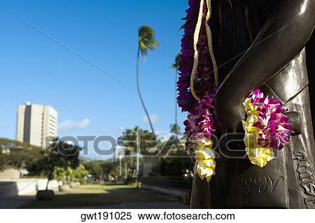 Stock Photography - Close-up of a garland hanging on a statue, Honolulu, Oahu, Hawaii Islands, USA. Fotosearch