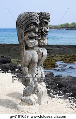 Two tiki torches on a sandy beach, Puuhonua O Honaunau National Historical Park, Kona Coast, Big Island, Hawaii Islands, USA View Large Photo Image Stock Photo - Two tiki torches on a sandy beach, Puuhonua O Honaunau National Historical Park, Kona Coast, Big Island, Hawaii Islands, USA. Fotosearch