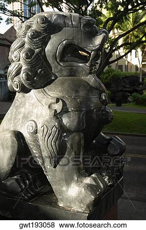 Stock Photo - Close-up of a lion statue in a park, Honolulu, Oahu, Hawaii Islands, USA. Fotosearch