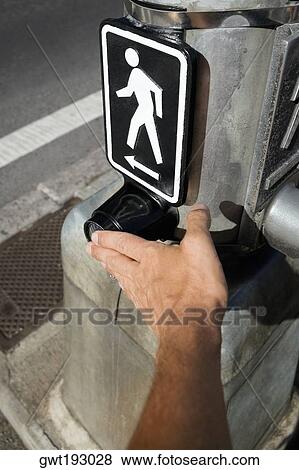 Close-up of a man's hand adjusting a pedestrian crossing signboard, Honolulu, Oahu, Hawaii Islands, USA View Large Photo Image Stock Photo - Close-up of a man's hand adjusting a pedestrian crossing signboard, Honolulu, Oahu, Hawaii Islands, USA. Fotosearch