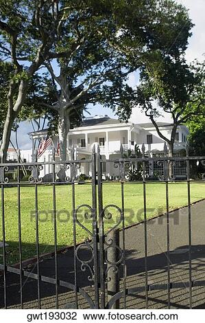 Close-up of a wrought iron gate with a building in the background, Honolulu, Oahu, Hawaii Islands, USA View Large Photo Image Stock Image - Close-up of a wrought iron gate with a building in the background, Honolulu, Oahu, Hawaii Islands, USA. Fotosearch