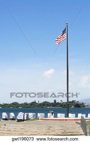 American flag fluttering at the seaside, Pearl Harbor, Honolulu, Oahu, Hawaii Islands, USA View Large Photo Image Stock Image - American flag fluttering at the seaside, Pearl Harbor, Honolulu, Oahu, Hawaii Islands, USA. Fotosearch