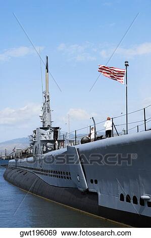 American flag fluttering on a military ship, USS Bowfin, Pearl Harbor, Honolulu, Oahu, Hawaii Islands, USA View Large Photo Image Stock Photo - American flag fluttering on a military ship, USS Bowfin, Pearl Harbor, Honolulu, Oahu, Hawaii Islands, USA. Fotosearch
