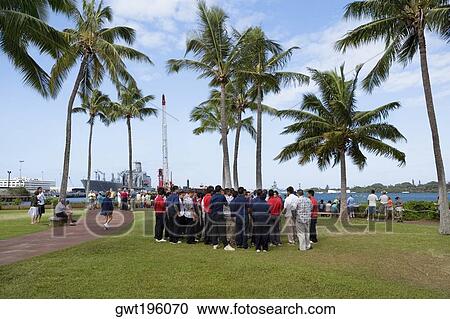 Group of people standing in a park, Pearl Harbor, Honolulu, Oahu, Hawaii Islands, USA View Large Photo Image Stock Image - Group of people standing in a park, Pearl Harbor, Honolulu, Oahu, Hawaii Islands, USA. Fotosearch