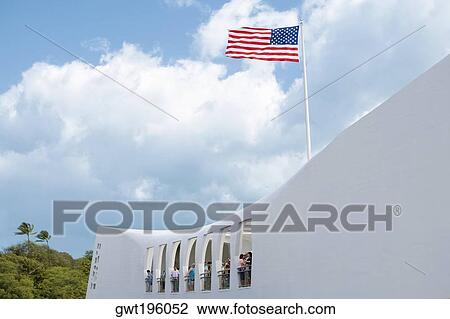 Low angle view of an American flag fluttering on a memorial building, USS Arizona Memorial, Pearl Harbor, Honolulu, Oahu, Hawaii Islands, USA View Large Photo Image Stock Image - Low angle view of an American flag fluttering on a memorial building, USS Arizona Memorial, Pearl Harbor, Honolulu, Oahu, Hawaii Islands, USA. Fotosearch