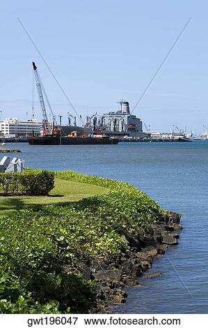 Military ship and a crane at a commercial dock, Pearl Harbor, Honolulu, Oahu, Hawaii Islands, USA View Large Photo Image Stock Photo - Military ship and a crane at a commercial dock, Pearl Harbor, Honolulu, Oahu, Hawaii Islands, USA. Fotosearch
