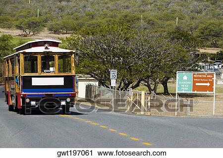 Stock Image - Bus on the road, Diamond Head, Waikiki Beach, Honolulu, Oahu, Hawaii Islands, USA. Fotosearch