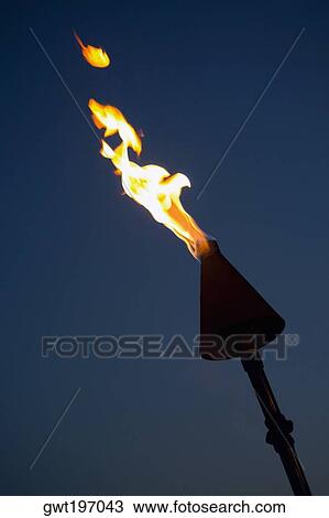 Stock Image - Close-up of a burning flaming torch. Fotosearch
