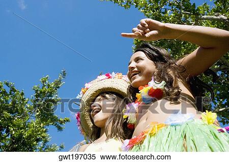 Low angle view of two girls dancing View Large Photo Image Stock Photography - Low angle view of two girls dancing. Fotosearch