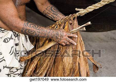 Mid section view of a man making a rope, Puuhonua O Honaunau National Historical Park, Kona Coast, Big Island, Hawaii Islands, USA View Large Photo Image Stock Photo - Mid section view of a man making a rope, Puuhonua O Honaunau National Historical Park, Kona Coast, Big Island, Hawaii Islands, USA. Fotosearch