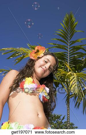 Portrait of a girl wearing flowers View Large Photo Image Stock Image - Portrait of a girl wearing flowers. Fotosearch