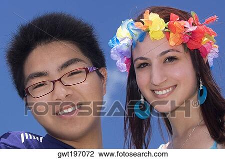 Portrait of a young man with his friend smiling View Large Photo Image Stock Image - Portrait of a young man with his friend smiling. Fotosearch