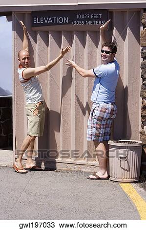 Two mid adult men posing against a wall, Haleakala National Park, Maui, Hawaii Islands, USA View Large Photo Image Stock Image - Two mid adult men posing against a wall, Haleakala National Park, Maui, Hawaii Islands, USA. Fotosearch