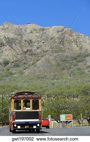 Stock Image - Vehicles moving on the road, Diamond Head, Waikiki Beach, Honolulu, Oahu, Hawaii Islands, USA. Fotosearch