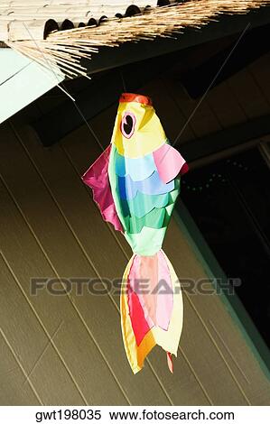 Artificial fish hanging with a thatched roof View Large Photo Image Stock Photography - Artificial fish hanging with a thatched roof. Fotosearch
