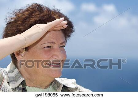 Close-up of a senior woman saluting View Large Photo Image Stock Photography - Close-up of a senior woman saluting. Fotosearch
