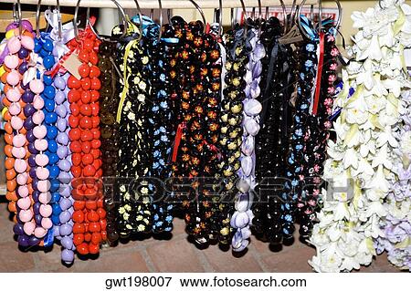 Close-up of garlands and necklaces hanging in a store View Large Photo Image Stock Photo - Close-up of garlands and necklaces hanging in a store. Fotosearch