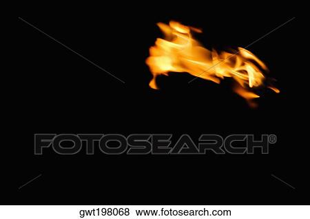 Close-up of the flame of a tiki torch View Large Photo Image Stock Photo - Close-up of the flame of a tiki torch. Fotosearch