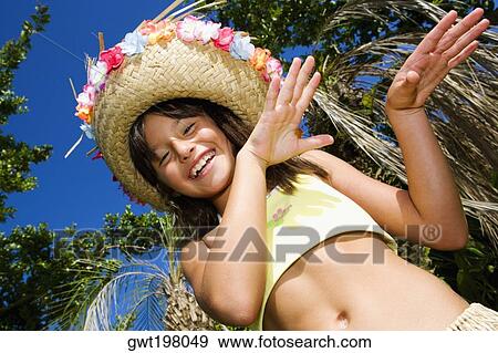 Portrait of a girl hula dancing and smiling View Large Photo Image Stock Photo - Portrait of a girl hula dancing and smiling. Fotosearch
