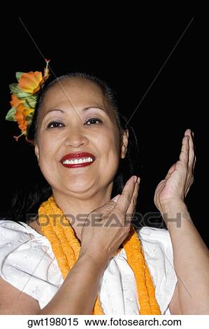 Portrait of a mature woman hula dancing and smiling View Large Photo Image Stock Photography - Portrait of a mature woman hula dancing and smiling. Fotosearch