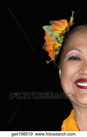 Portrait of a mature woman wearing flowers and smiling View Large Photo Image Stock Photo - Portrait of a mature woman wearing flowers and smiling. Fotosearch