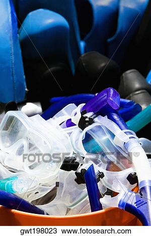 Snorkels and scuba masks in a bucket View Large Photo Image Stock Image - Snorkels and scuba masks in a bucket. Fotosearch
