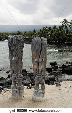 Statues of tiki torch on the beach, City Of Refuge, Kona Coast, Puuhonua O Honaunau National Historical Park, Big Island, Hawaii Islands, USA View Large Photo Image Stock Photograph - Statues of tiki torch on the beach, City Of Refuge, Kona Coast, Puuhonua O Honaunau National Historical Park, Big Island, Hawaii Islands, USA. Fotosearch