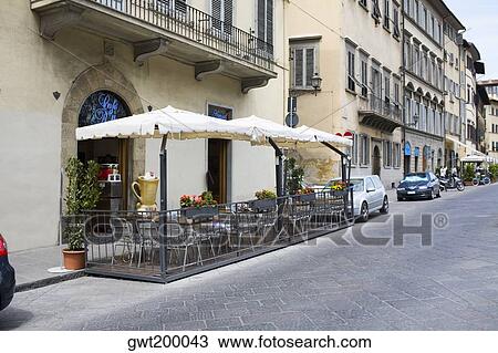 Empty chairs at a sidewalk cafe, Florence, Italy View Large Photo Image Stock Image - Empty chairs at a sidewalk cafe, Florence, Italy. Fotosearch