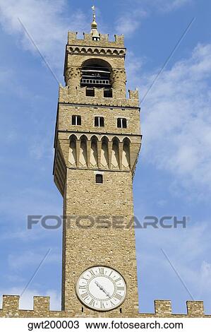 Low angle view of a clock tower, Pallazo Vecchio, Piazza Della Signoria, Florence, Italy View Large Photo Image Stock Image - Low angle view of a clock tower, Pallazo Vecchio, Piazza Della Signoria, Florence, Italy. Fotosearch