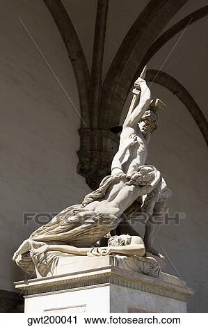 Low angle view of statues on a pedestal, Uffizi Museum, Florence, Tuscany, Italy View Large Photo Image Stock Image - Low angle view of statues on a pedestal, Uffizi Museum, Florence, Tuscany, Italy. Fotosearch