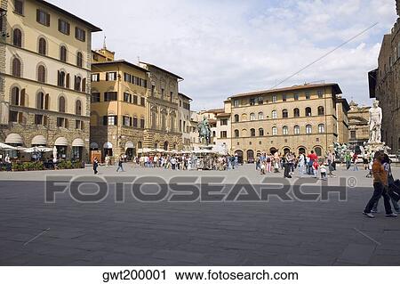 Stock Image - Tourists in front of a palace, Cosme I de Medicis, Pallazo Vecchio, Florence, Italy. Fotosearch