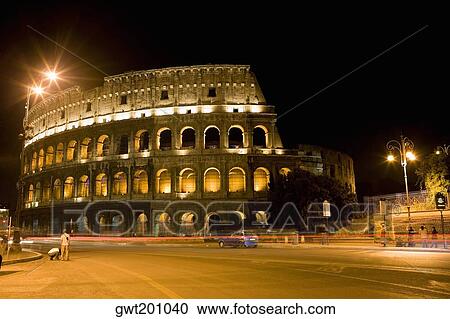 Amphitheater lit up at night, Coliseum, Rome, Italy View Large Photo Image Stock Image - Amphitheater lit up at night, Coliseum, Rome, Italy. Fotosearch