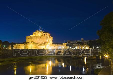 Stock Image - Bridge across a river, Ponte Sant Angelo, Hadrian's Tomb, Tiber River, Rome, Italy. Fotosearch