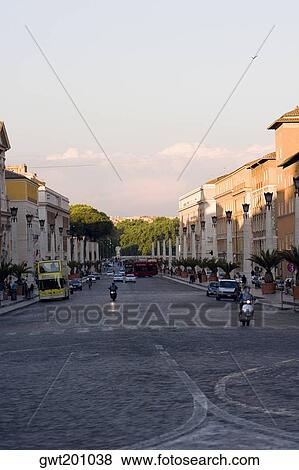 Stock Photo - Buildings on both sides of a road, Rome, Italy. Fotosearch