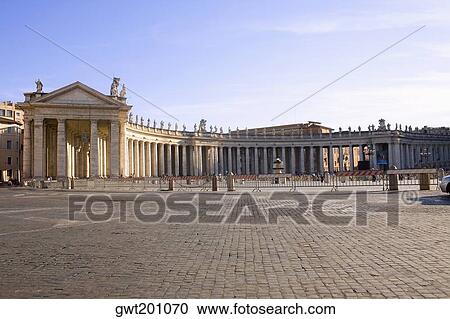 Stock Image - Facade of a building, Bernini's Colonnade, St. Peter's Square, Vatican, Rome, Italy. Fotosearch