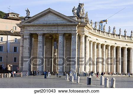 Stock Image - Facade of a church, Bernini's Colonnade, St. Peter's Square, Vatican City. Fotosearch