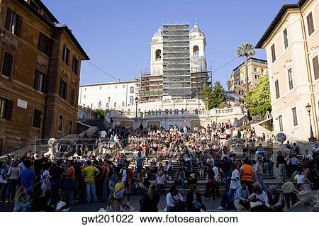 Stock Image - Group of people in front of a church, Trinita Dei Monti, Rome, Italy. Fotosearch