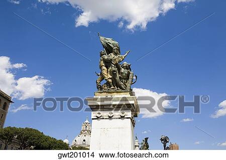 Picture - Low angle view of statues on the pedestal, Rome, Italy. Fotosearch
