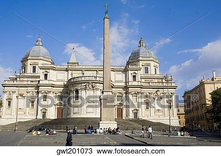 Stock Image - Obelisk in front of a church, Piazza dell'Esquilino, Santa Maria Maggiore Church, Rome, Italy. Fotosearch