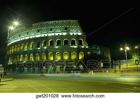 Old ruin of an amphitheater lit up at night, Coliseum, Rome, Italy View Large Photo Image Stock Photo - Old ruin of an amphitheater lit up at night, Coliseum, Rome, Italy. Fotosearch