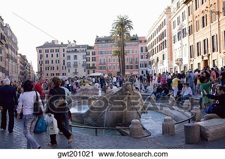 Tourists around a fountain, Piazza di Spagna, Rome, Italy View Large Photo Image Stock Image - Tourists around a fountain, Piazza di Spagna, Rome, Italy. Fotosearch