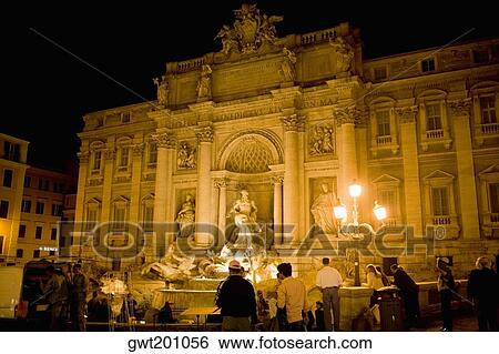 Tourists in front of a building, Trevi Fountain, Rome, Italy View Large Photo Image Stock Photograph - Tourists in front of a building, Trevi Fountain, Rome, Italy. Fotosearch