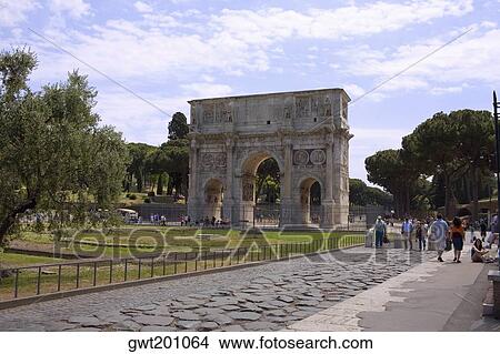 Picture - Tourists near a triumphal arch, Arch Of Constantine, Rome, Italy. Fotosearch