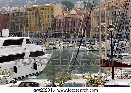 Boats moored at a harbor, Bassin Lympia, Nice, France View Large Photo Image Stock Photography - Boats moored at a harbor, Bassin Lympia, Nice, France. Fotosearch
