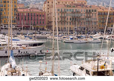 Boats moored at a harbor, Nice, France View Large Photo Image Stock Image - Boats moored at a harbor, Nice, France. Fotosearch